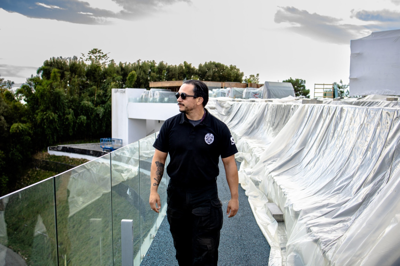 Valcor Security officer patrolling a construction site with wrapped materials