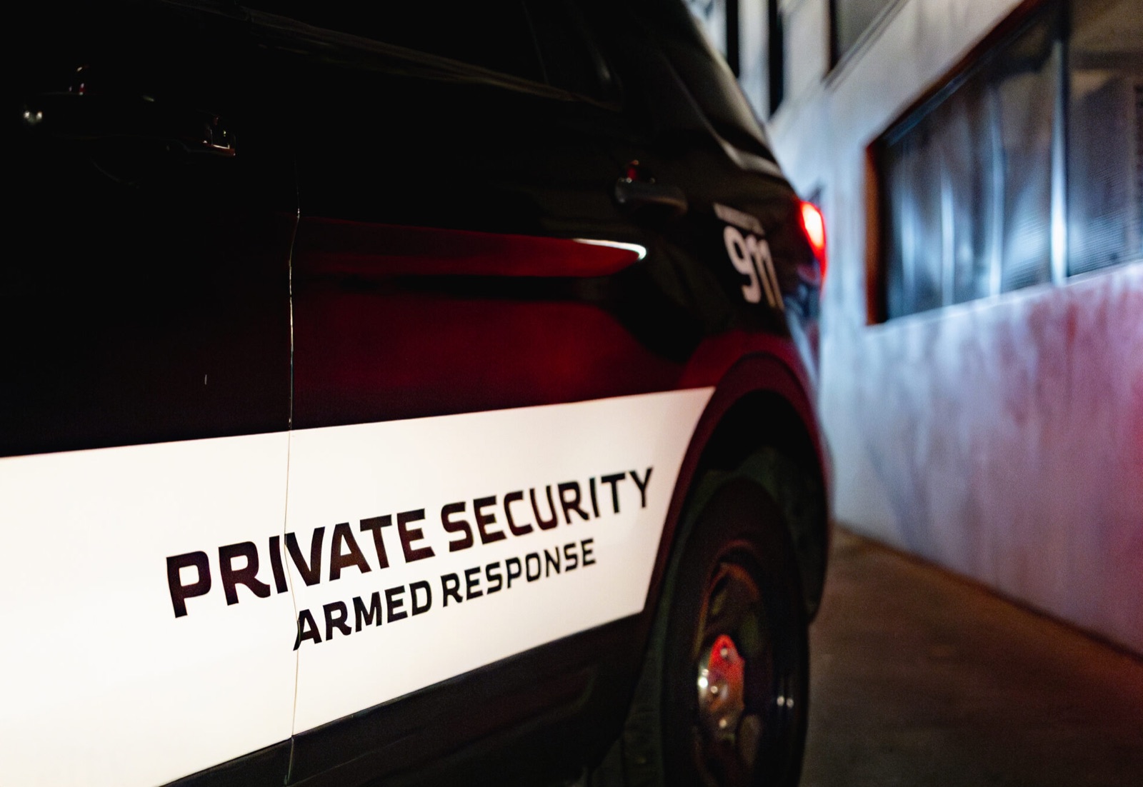Marked Valcor armed-response patrol vehicle on night patrol